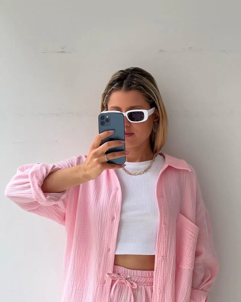 Luxury women's 2-piece set displayed elegantly, showcasing the fashionable grass green colour and loose fit for summer chic.