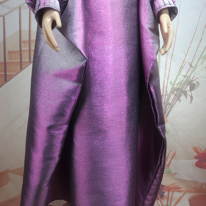 Close-up of luxurious rhinestone embellishments on v-neckline of African church boubou dress for women.