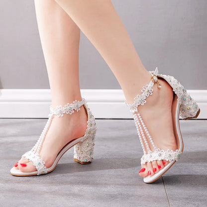 Elegant white high heel gladiator sandals for plus size women, embellished with lace flowers and beads, perfect for formal occasions.