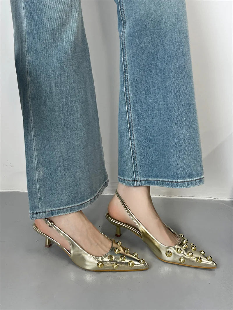 Stylish summer sandals showcasing a sleek back strap and thin heels, designed for a luxurious look and feel.