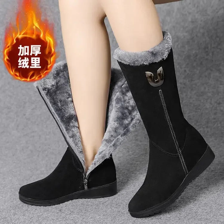Luxurious women's high fur boots crafted from faux suede, featuring a stylish mid-calf design and elegant side zipper, perfect for winter elegance.