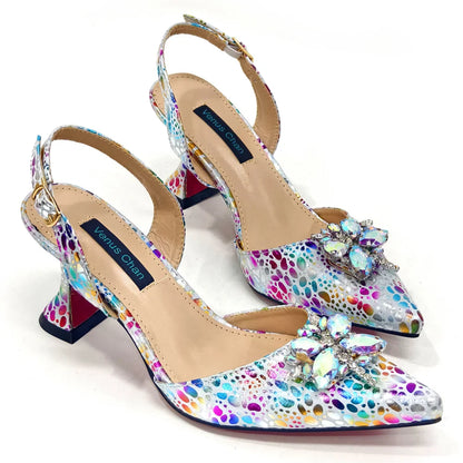 Luxurious matching bag set featuring a metallic handle and a long chain shoulder strap, ideal accompaniment for champagne coloured heels.