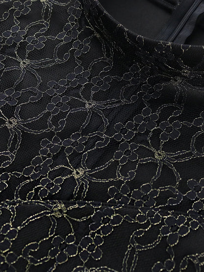 Stylish model wearing a black long high neck lace patchwork bodycon dress, perfect for evening events and clubs, available in sizes S to 4XL.