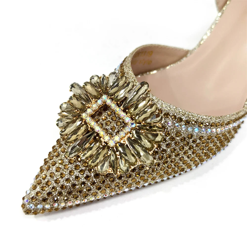 Chic matching handbag in black with a metal handle, beautifully designed to complement women's elegant party shoes.