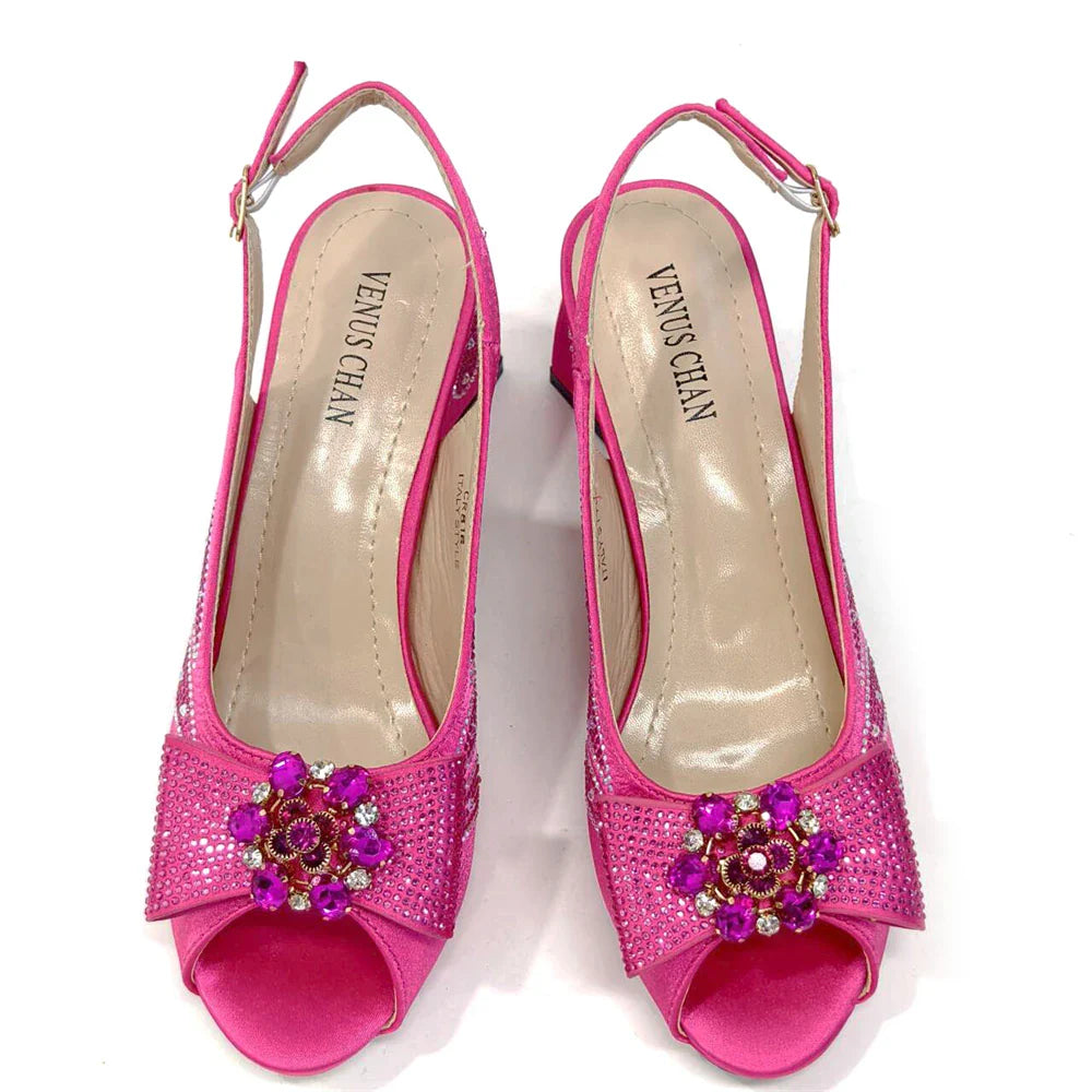 Elegant close-up of the Venus Chan bag, accentuating the sophisticated metal handle and vibrant purple hue for a luxury look.