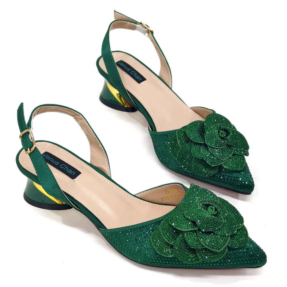 Elegant women's pointed-toe pump and bag set featuring exquisite large flower and dazzling rhinestone details, perfect for upscale occasions.