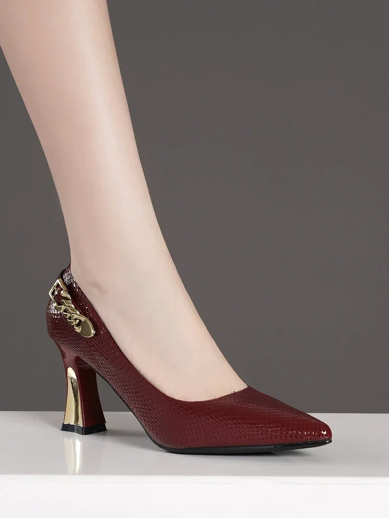 Elegant XINGDIKU women's basic snakeskin leather pumps featuring stiletto high heels and a sophisticated pointy toe design.