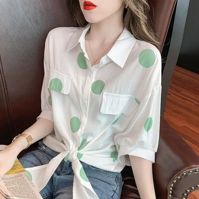 Chic half sleeve blouse for women designed with a modern polka dot pattern and a sophisticated bandage bow, ideal for casual events.