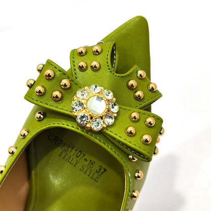 Fashion-forward matching handbag set for women in bright tones, beautifully complementing high heeled shoes with rivets.