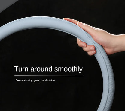 Luxurious Napa leather steering wheel cover featuring elegant perforated patchwork design, ensuring non-slip and breathable comfort for a stylish driving experience.