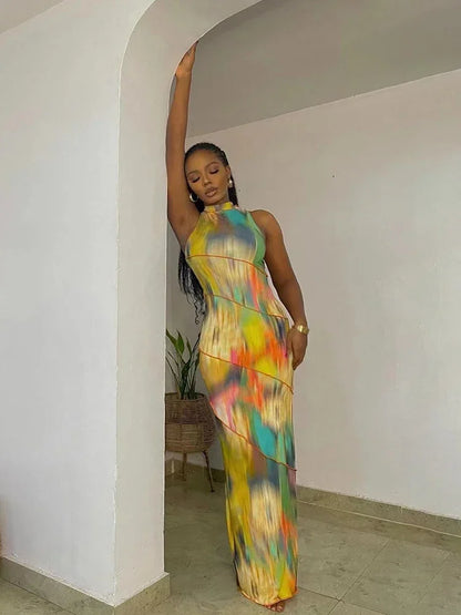 Elegant BWQ Maxi Dress for Women featuring a vibrant tie-dye pattern, sleek asymmetrical design, and sleeveless style, perfect for luxurious streetwear fashion.