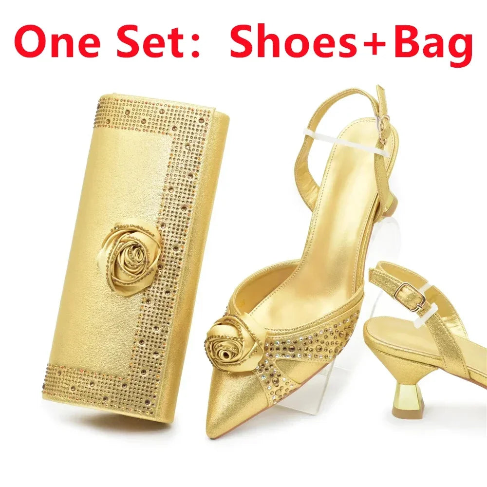 A stunning gold women's shoe and bag set showcased elegantly, designed for sophisticated parties, highlighting high spike heels and intricate handmade floral embellishments.