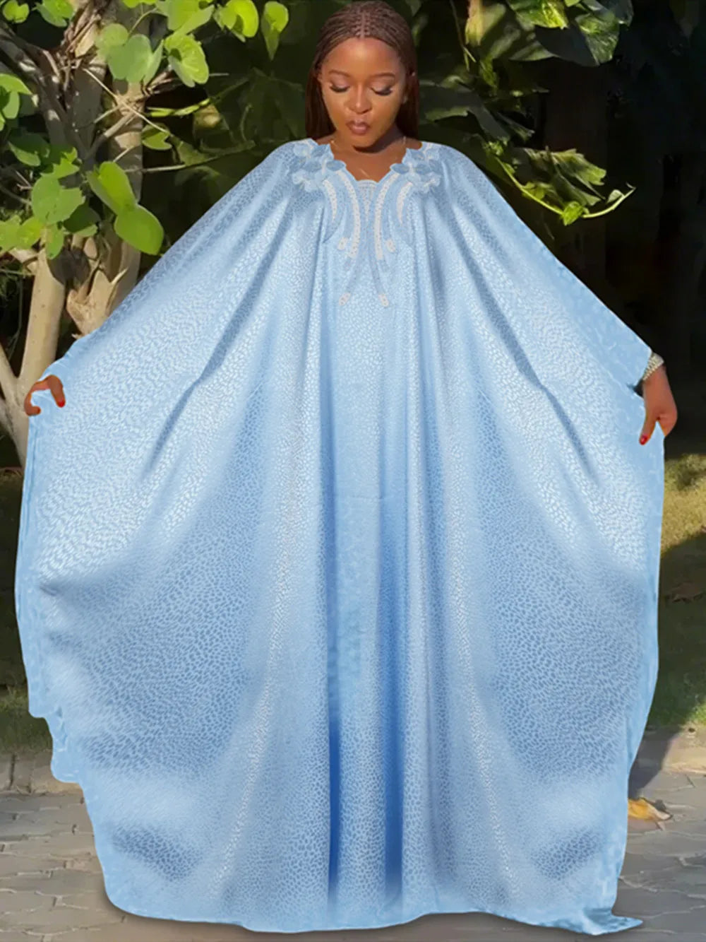 Refined satin abaya dress, featuring stunning embroidery, designed for middle-aged women who embrace fashion and culture with grace.