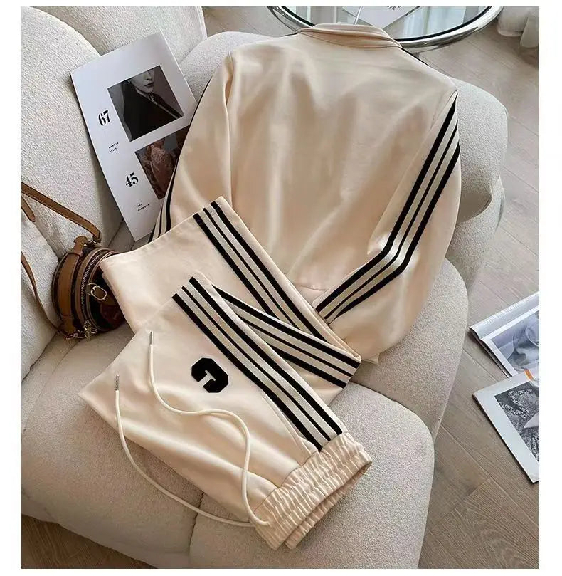 Close-up of embroidered details on a high-end women's sports coat, showcasing refined craftsmanship and modern design.