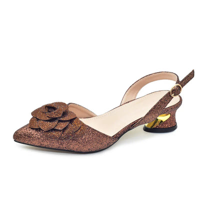 Elegant women's high-heeled pumps with rhinestones paired with a luxurious handbag, designed for parties and formal events.