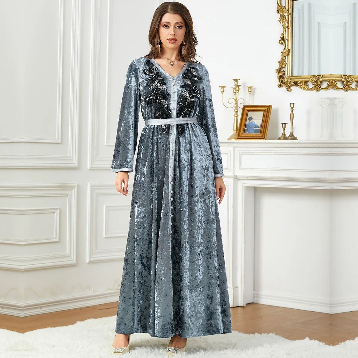 Bat sleeve Moroccan dress in luxurious golden velvet, elegantly designed with sequins for an upscale Ramadan outfit that radiates elegance.