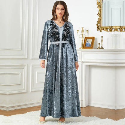 Bat sleeve Moroccan dress in luxurious golden velvet, elegantly designed with sequins for an upscale Ramadan outfit that radiates elegance.