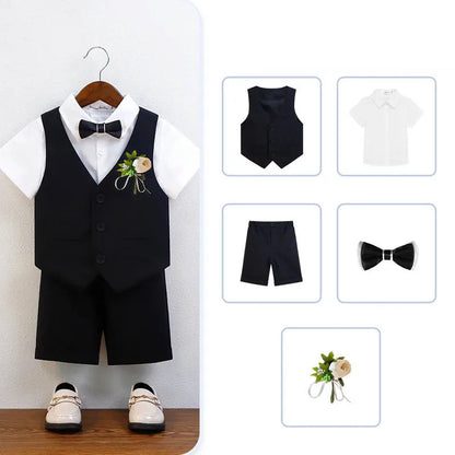 Sophisticated green and white boys formal wear set for baptisms, including a vest, shirt, shorts, and bowtie for children aged 7-13 years.