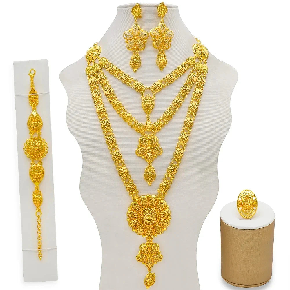 Luxury gold colour jewelry set featuring a bridal necklace, earrings, bracelet, and ring inspired by elegant African design for women.