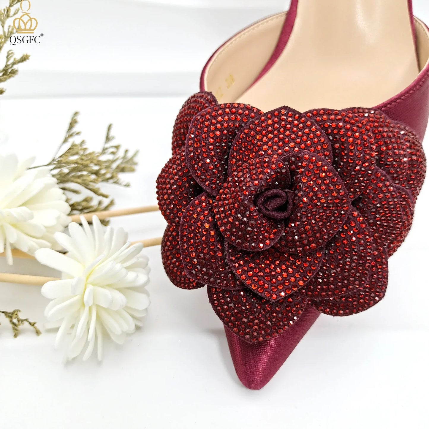 Elegant QSGFC Women's Pump shoes with a unique ankle strap and floral details, perfect for elevating evening attire.