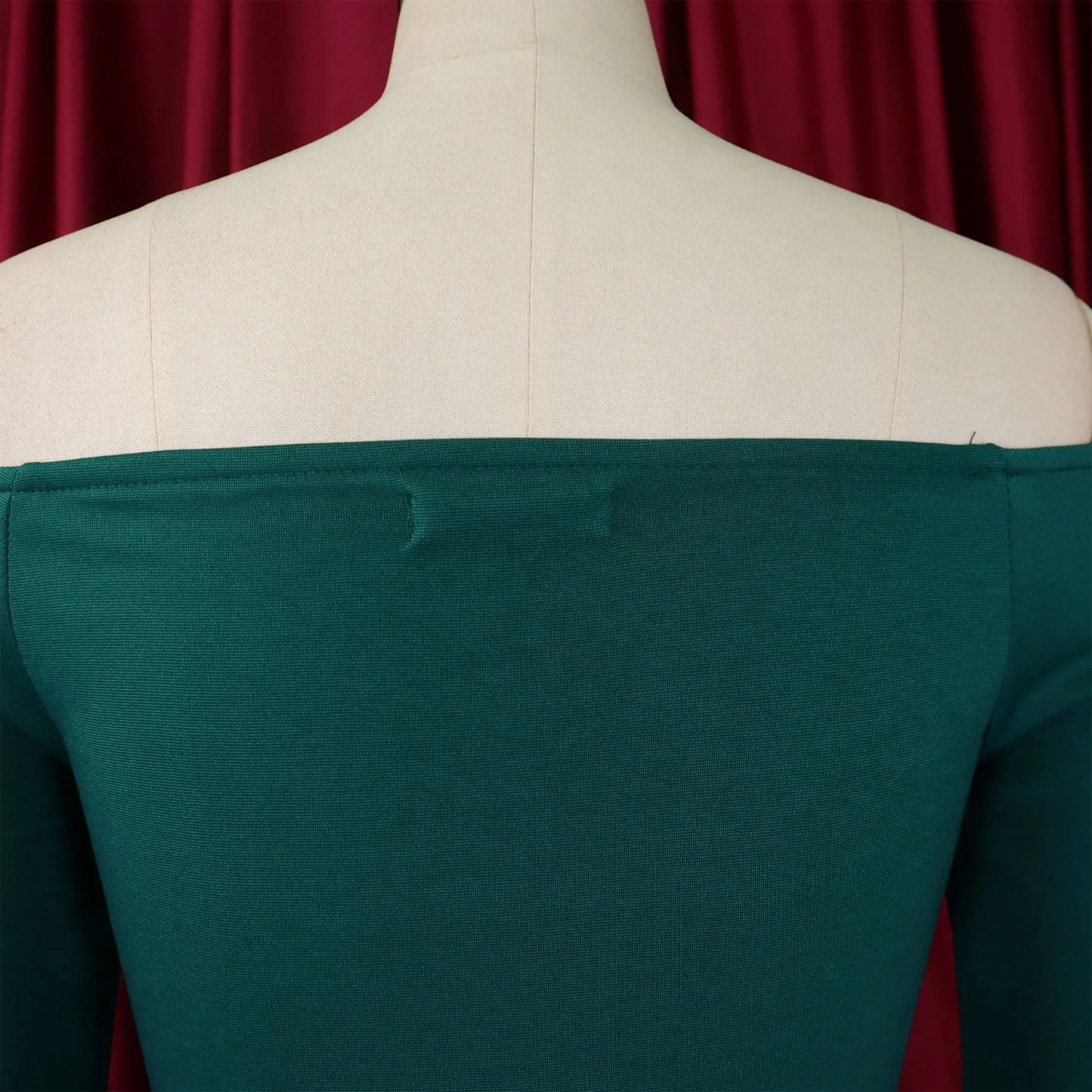 Close-up view of the exquisite fabric and draped detailing of the FairyShely Solid Bodycon Dress, designed for a flattering fit on curvy women.