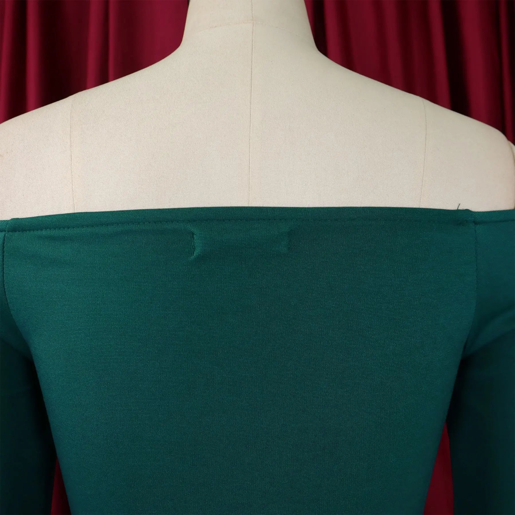 Close-up view of the exquisite fabric and draped detailing of the FairyShely Solid Bodycon Dress, designed for a flattering fit on curvy women.