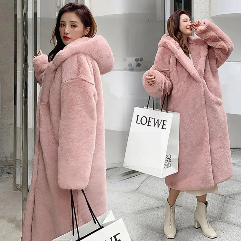 Opulent faux fur outerwear coat for women featuring single breasted closure and regular fit.