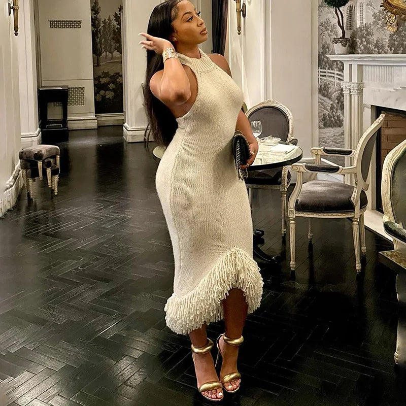 CM.YAYA Women's luxurious mid-calf length dress displayed on a model, illustrating the graceful drape and fitted design that enhances feminine curves for a glamorous look.