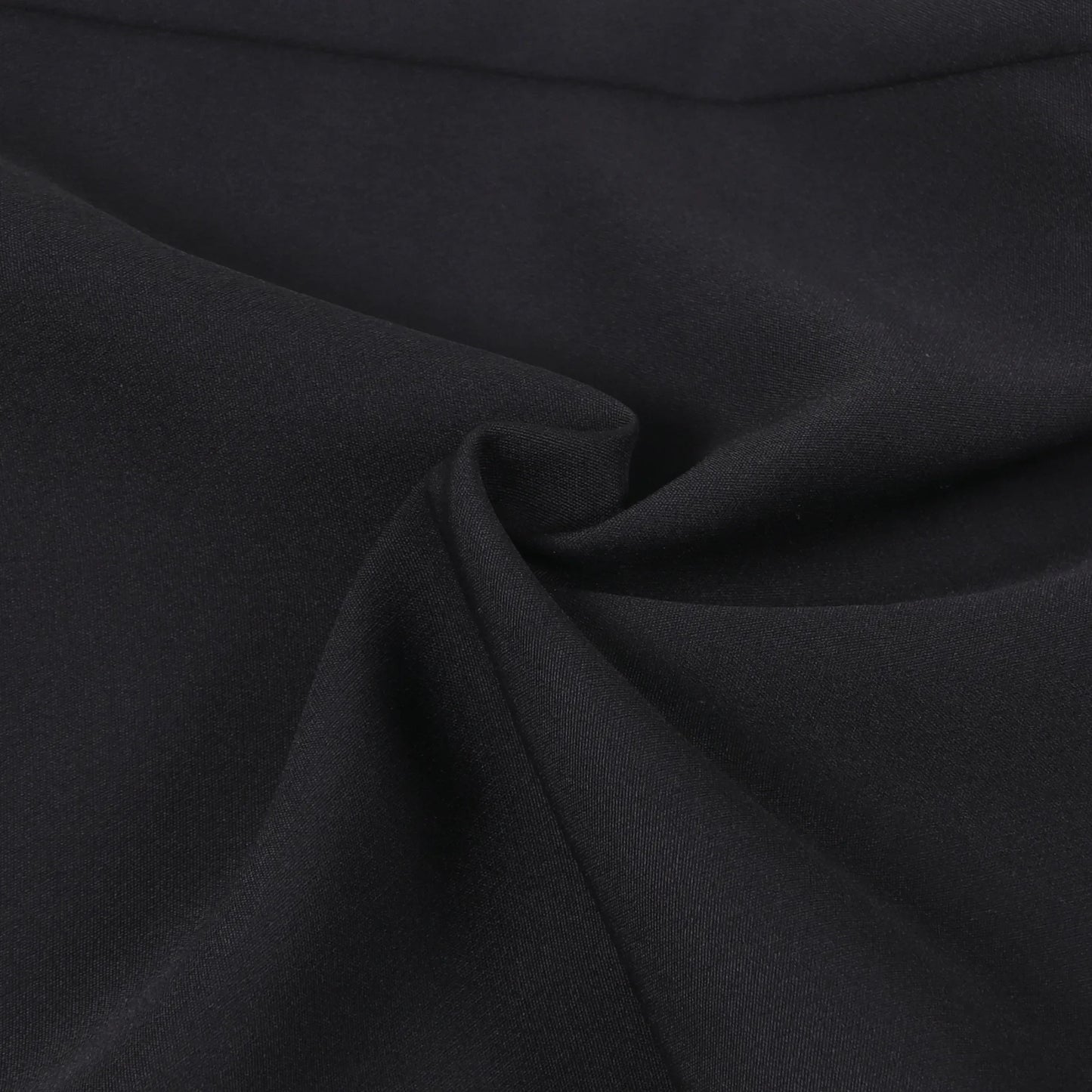 Close-up of luxurious fabric of women's X-Long blazer coat, showcasing the smooth synthetic finish and timeless style for modern working women.