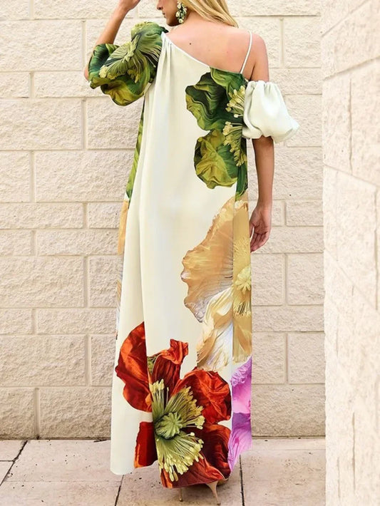 Close-up view of UOOZEE's exquisite floral pattern on a sophisticated evening maxi dress, showcasing fine craftsmanship and attention to detail for an elegant look.
