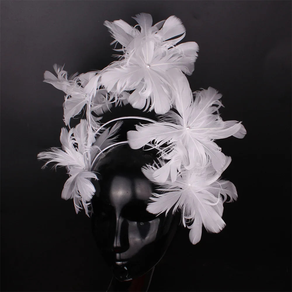 Fashion-forward blue feather headband for women, a must-have accessory for weddings and formal gatherings.