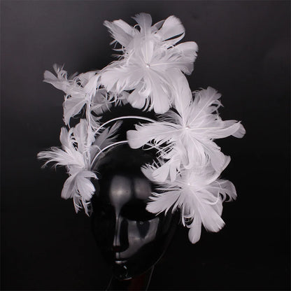 Fashion-forward blue feather headband for women, a must-have accessory for weddings and formal gatherings.