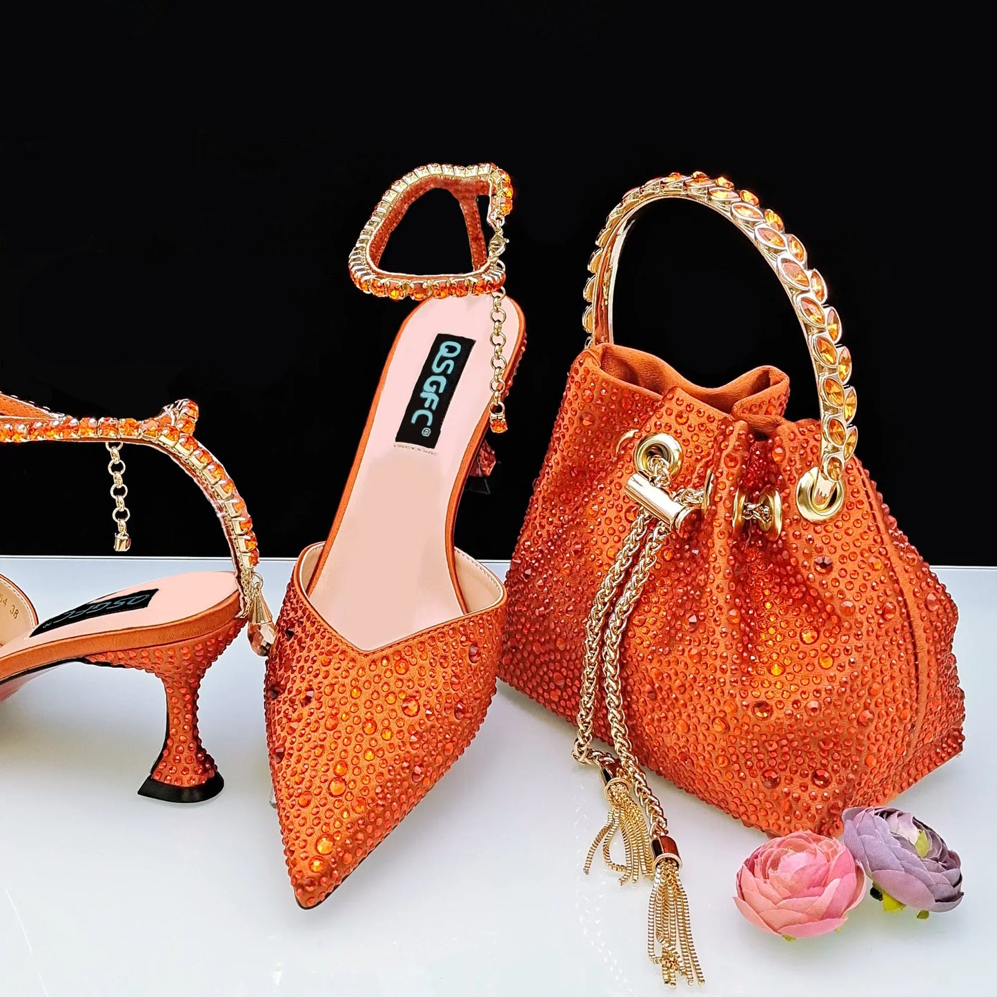 Fashionable high-heeled pumps in gold glitter, showcasing unique rhinestone shapes, designed for women's elegance at parties.