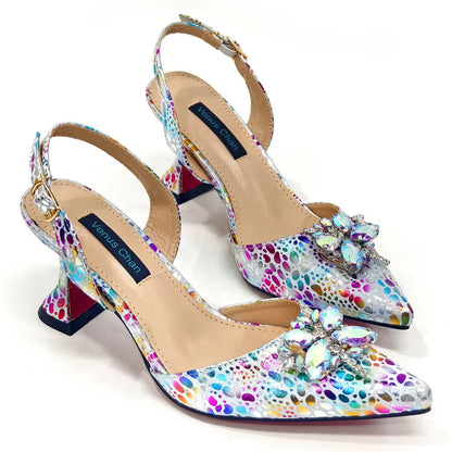 Chic close-up of yellow high heels featuring a pointed toe and crystal embellishments, ideal for luxurious styling.