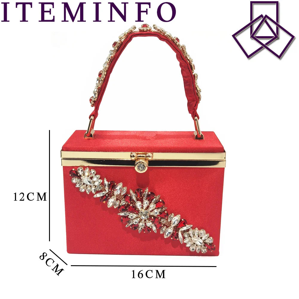 Stylish red handbag with a metal handle and long chain shoulder strap, beautifully complementing the pointed toe shoe ensemble.