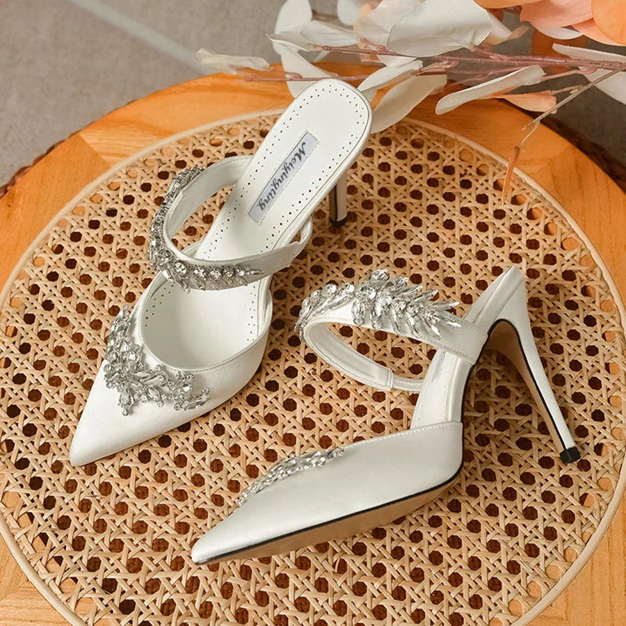 Fashion-forward women's pointed toe sandals with low heels, showcasing exquisite silk and rhinestone details.
