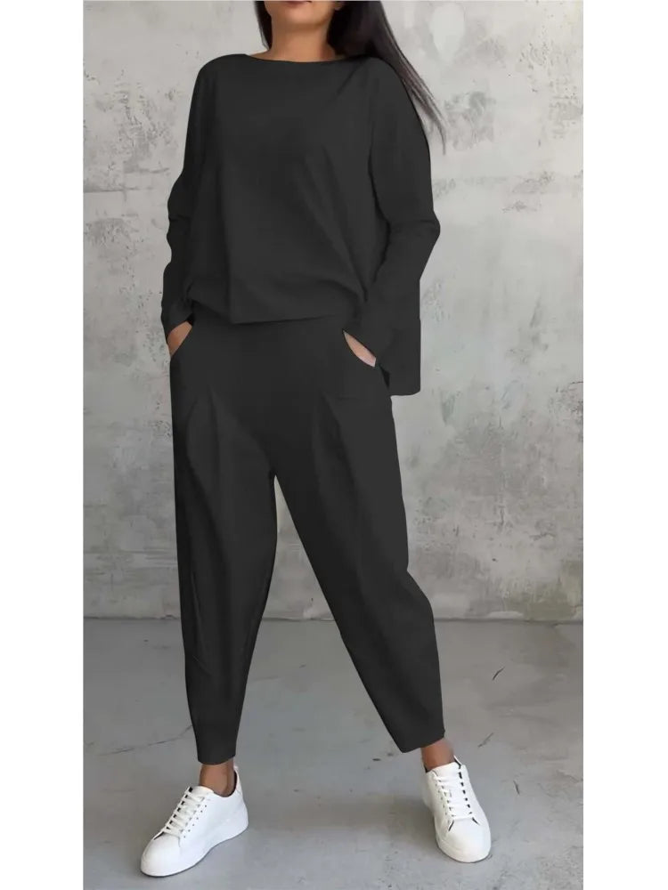 Ankle-length harem pants with elastic waist, embodying effortless elegance in women's sportswear.