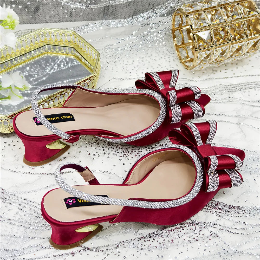 Close-up view of stylish women's high-heeled party sandals, featuring elegant crystal detailing and a chic peep toe style.
