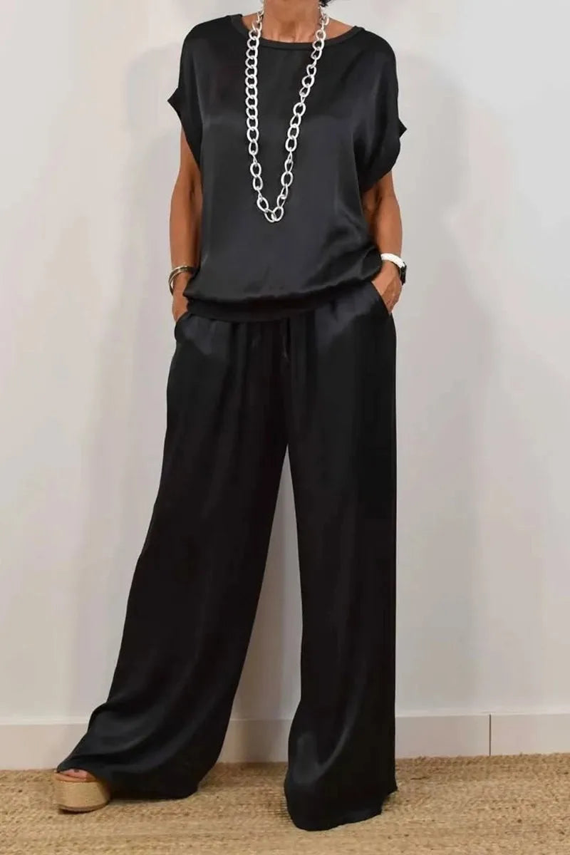 Elegant women's luxury casual O-neck satin t-shirt in soft fabric paired with wide leg pants, perfect for summer fashion.
