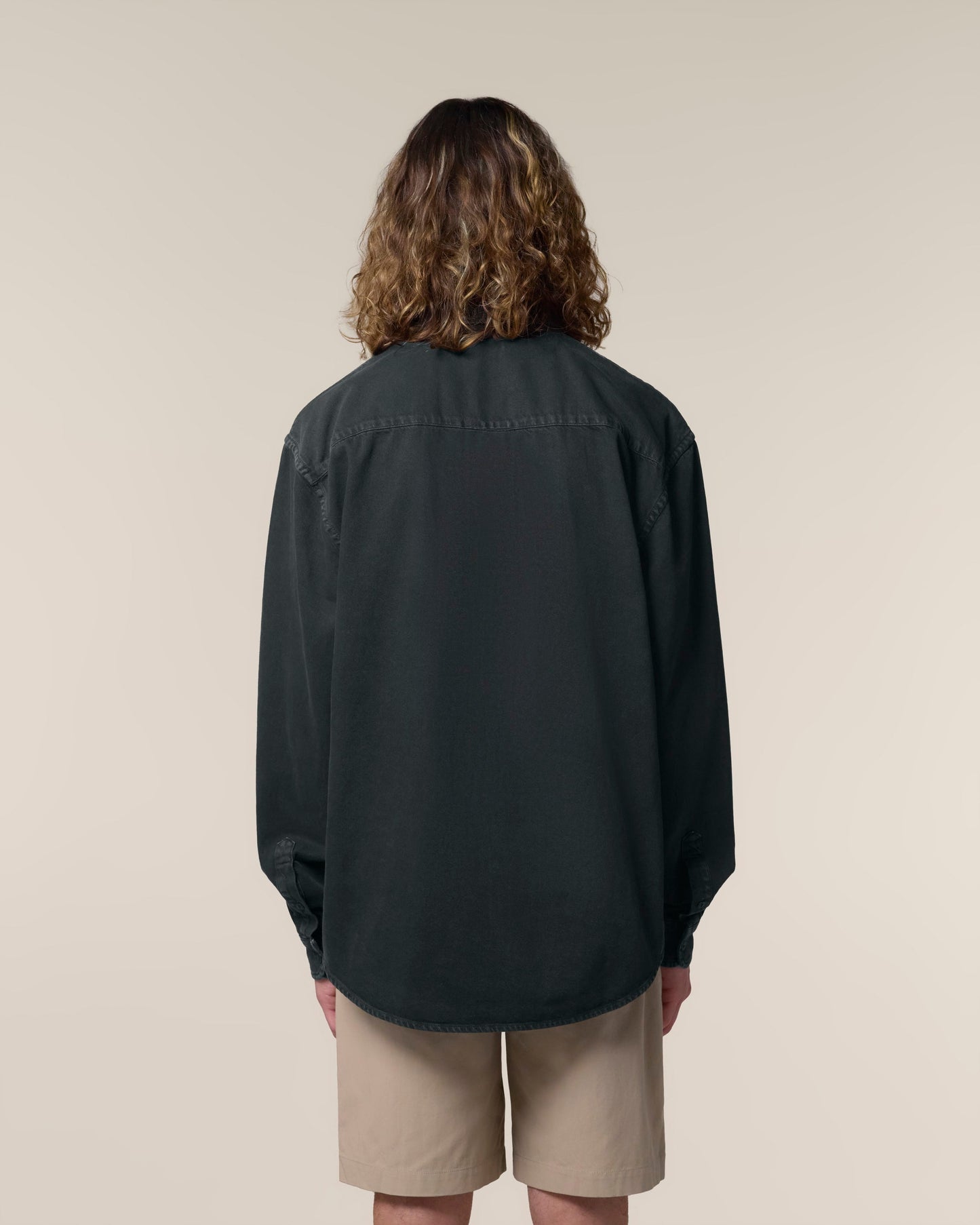 Luxurious 100% organic cotton heavy relaxed unisex shirt, showcasing its soft texture and stylish oversized fit, perfect for elegant everyday wear.