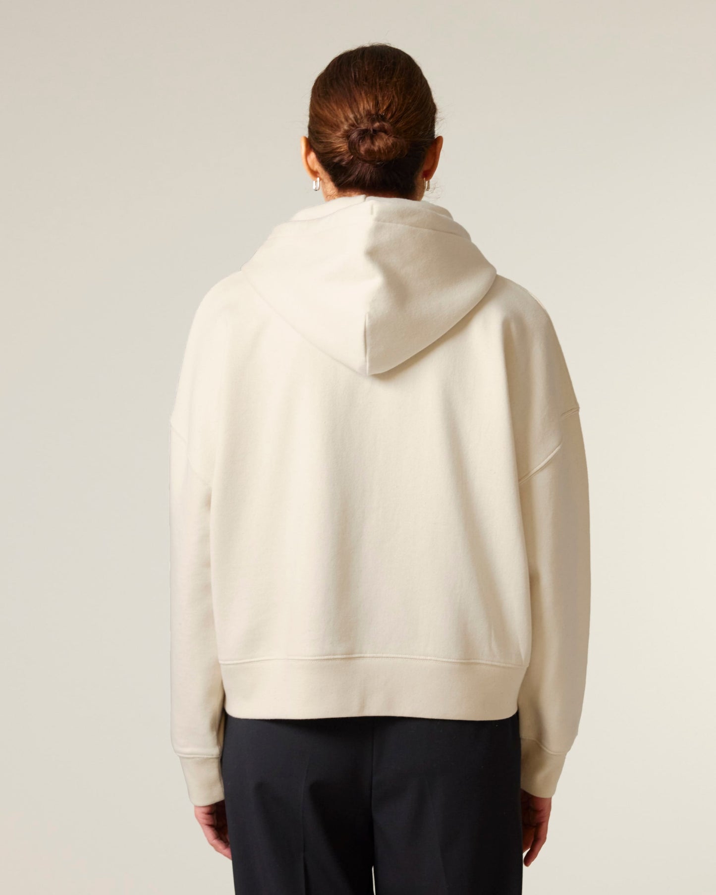 Luxury organic cotton zipped hoodie for women featuring a dropped shoulder design and tailored medium fit, ideal for comfort and style.