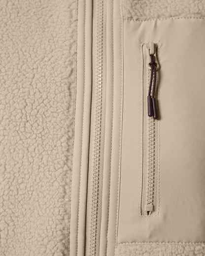 Unisex sherpa fleece bodywarmer draped stylishly on a mannequin, illustrating its versatility and eco-friendly design.