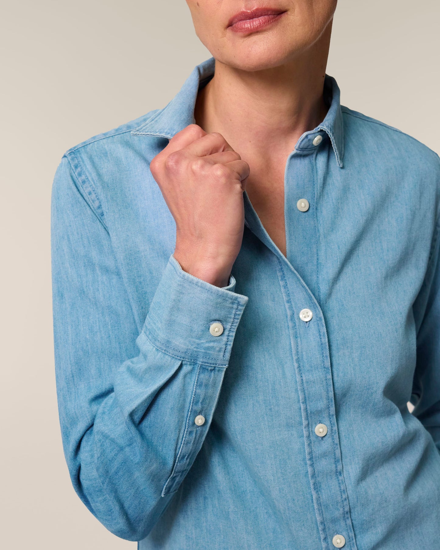 Elegantly styled Sustainable Organic Cotton Long Sleeve Denim Shirt for Women, showcasing eco-friendly fashion with a tailored fit and classic denim design.