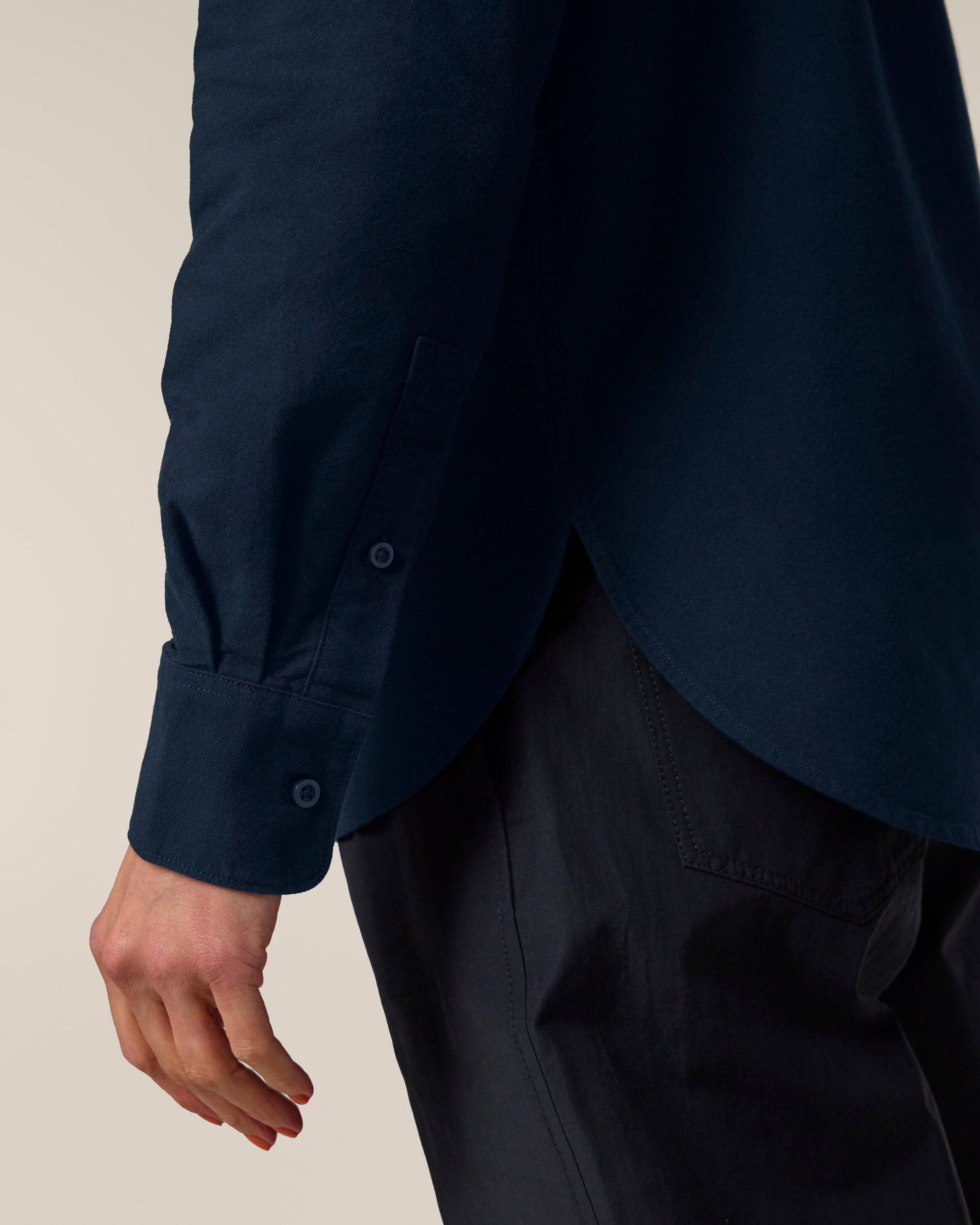 Model wearing an elegant organic cotton oxford long sleeve shirt, demonstrating comfort and style in a luxurious setting.