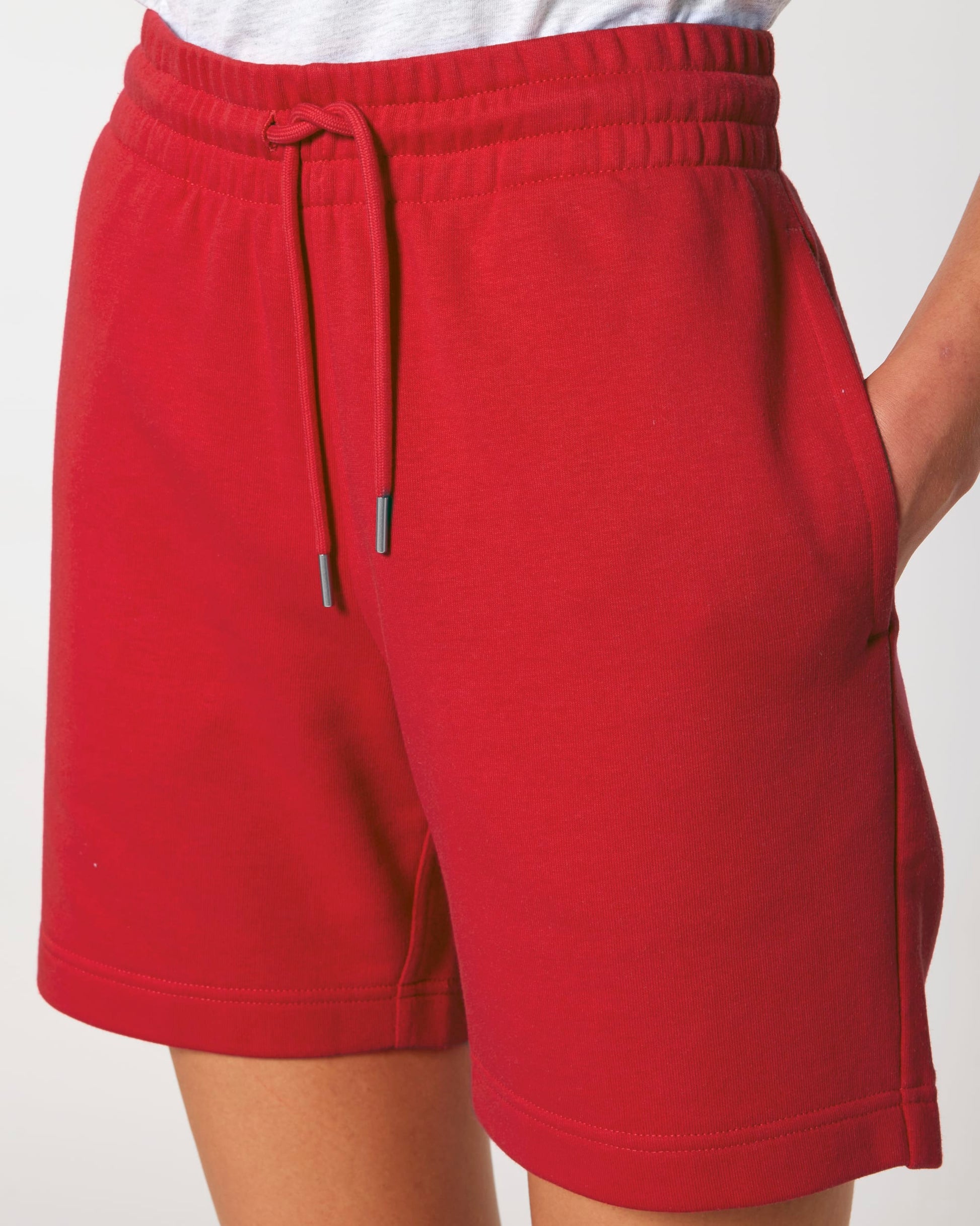 Close-up of the soft organic cotton fabric of premium jogger shorts, highlighting the eco-conscious blend of 85% organic cotton with 15% recycled polyester for a sustainable choice.