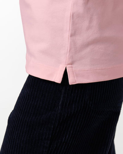 Stylish model wearing the luxuriously soft organic cotton women’s polo shirt, exemplifying everyday elegance and sustainable fashion.