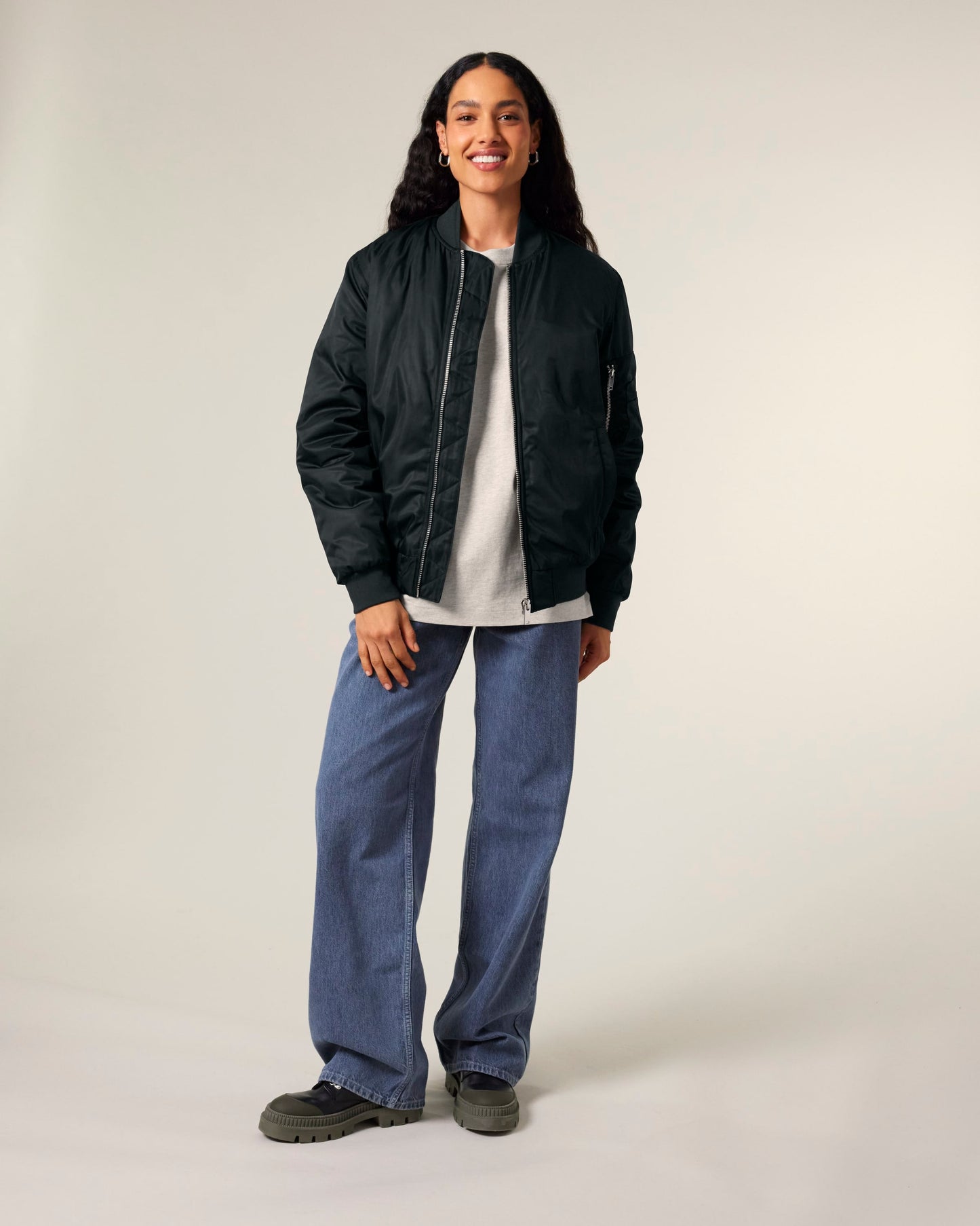 Detailed view of the eco-conscious design elements of the luxury bomber jacket, highlighting its sustainable craftsmanship.