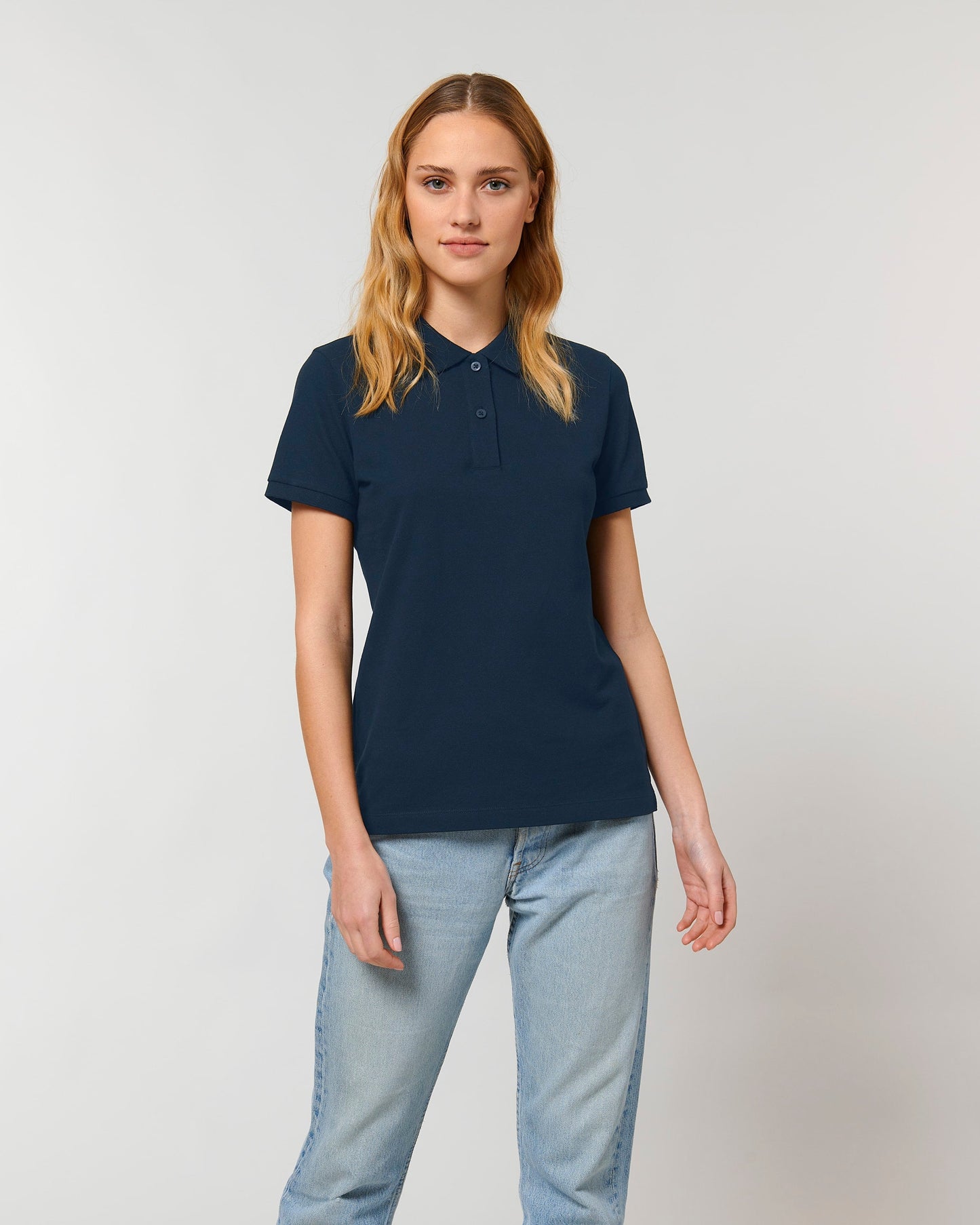 Stylish and sustainable women's polo shirt in an array of colours, made from organic cotton, highlighting its luxurious softness and eco-friendly attributes.
