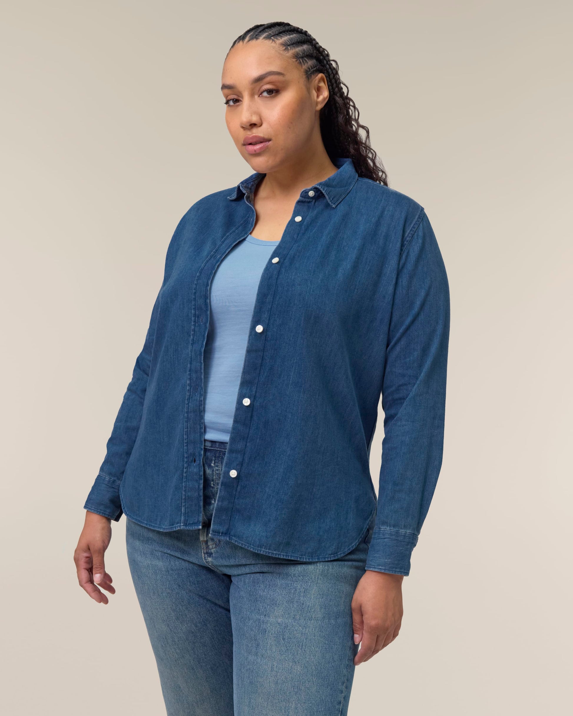 Chic long sleeve denim shirt for women, made from breathable organic cotton, epitomising luxury and sustainability in fashion.