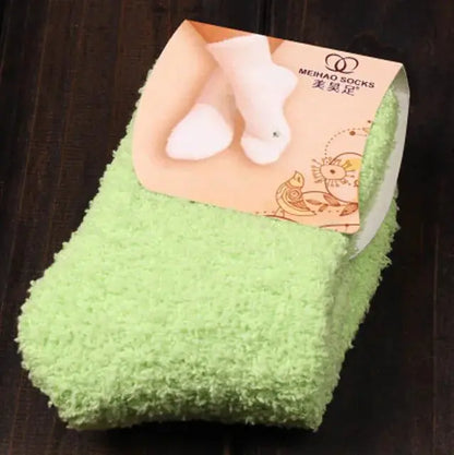 Stylish Women's Bed Socks in fresh green, featuring plush coral fleece material, a delightful accessory for your winter loungewear collection.